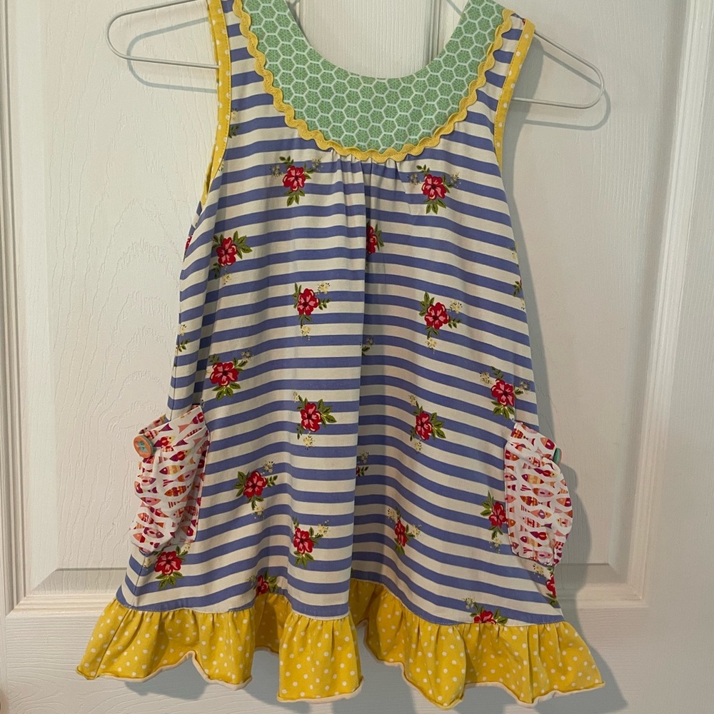 Girl’s Matilda Jane Blue and white striped top with yellow ruffle.